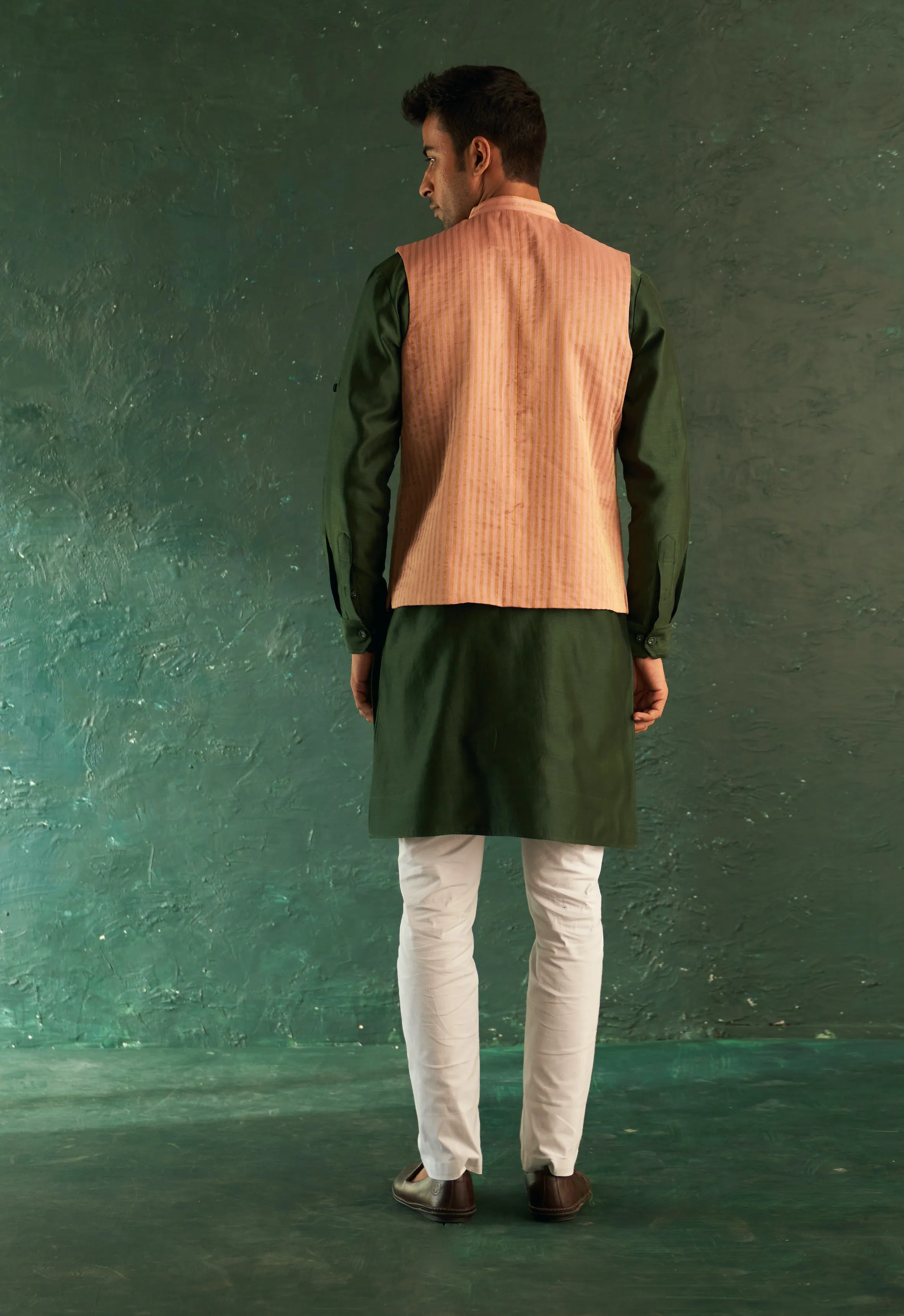 Green straight kurta and pink nehru jacket set