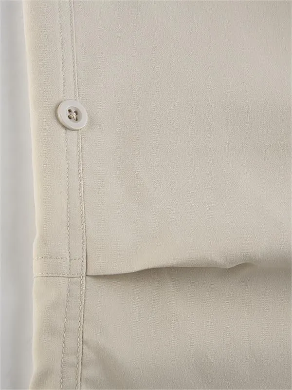 Light colored baggy parachute cargo pants with drawstring and low waist